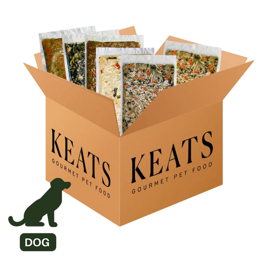 An open tan cardboard box labeled KEATS Gourmet Pet Food, filled with several pet treat pouches, on a white background. A dark green dog silhouette and the word DOG appear in the lower left corner.